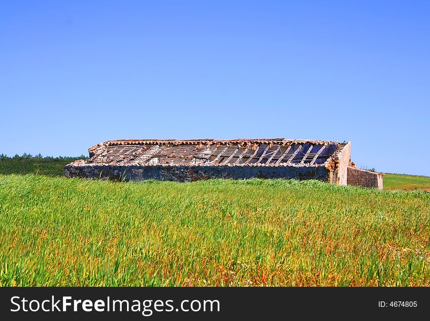 Abandoned building in surrounded by lush grassland in Portugal Algarve Coast. Abandoned building in surrounded by lush grassland in Portugal Algarve Coast