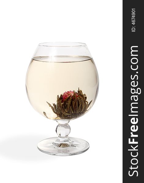 Glass with a flower green tea on white background