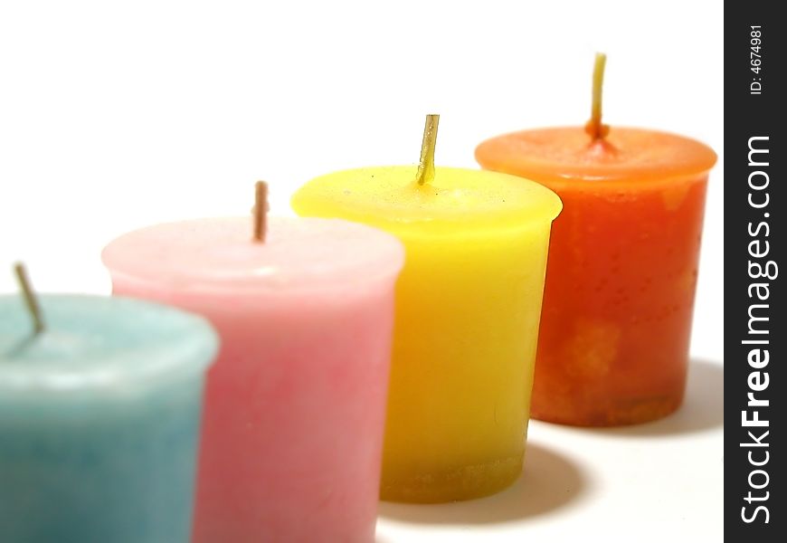 Four candles lined and isolated on a white background. Four candles lined and isolated on a white background.