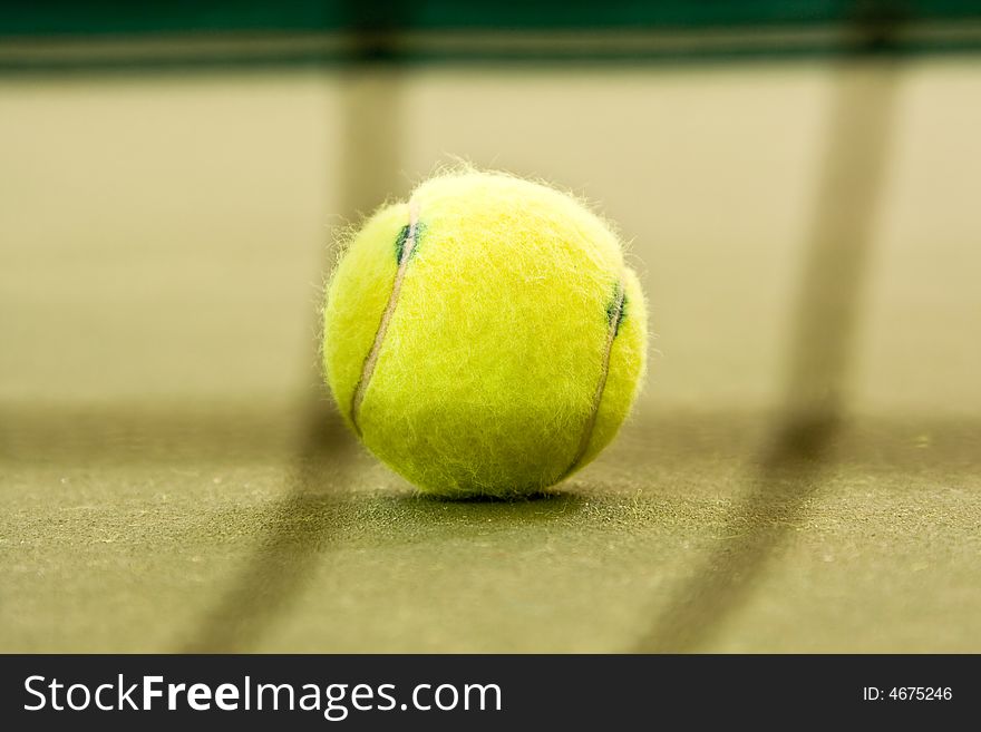 A tennis ball on the court