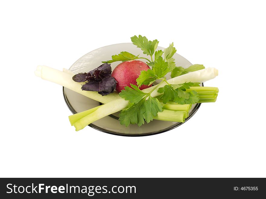 Fresh vegetables and herbs on a plate, isolated, on white background. Fresh vegetables and herbs on a plate, isolated, on white background