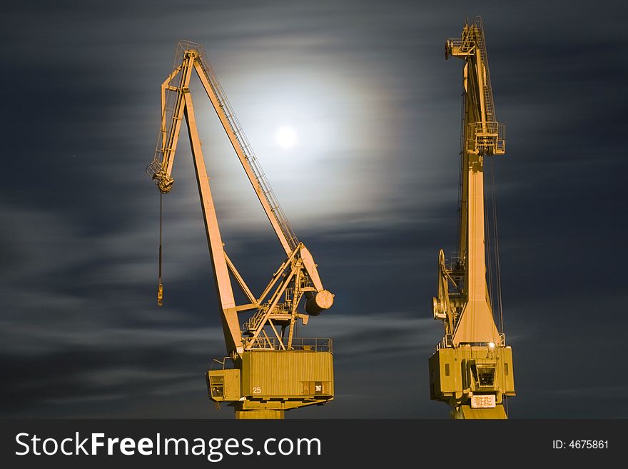 Two old cranes and moonlight