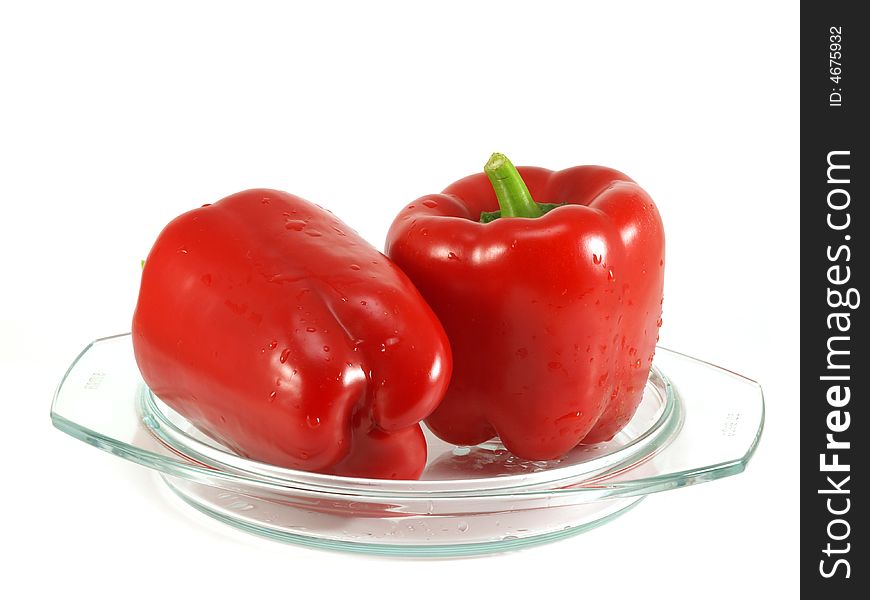 Red pepper and leaves of salad isolated on a white background