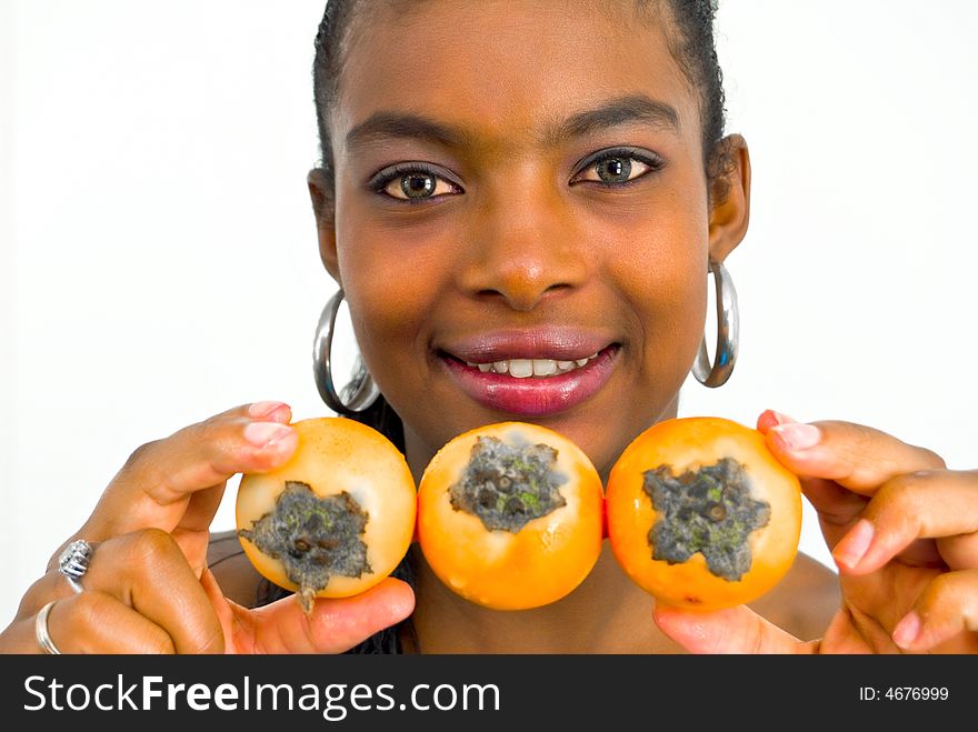 Happy beautiful african girl with three yellow tropical fruits