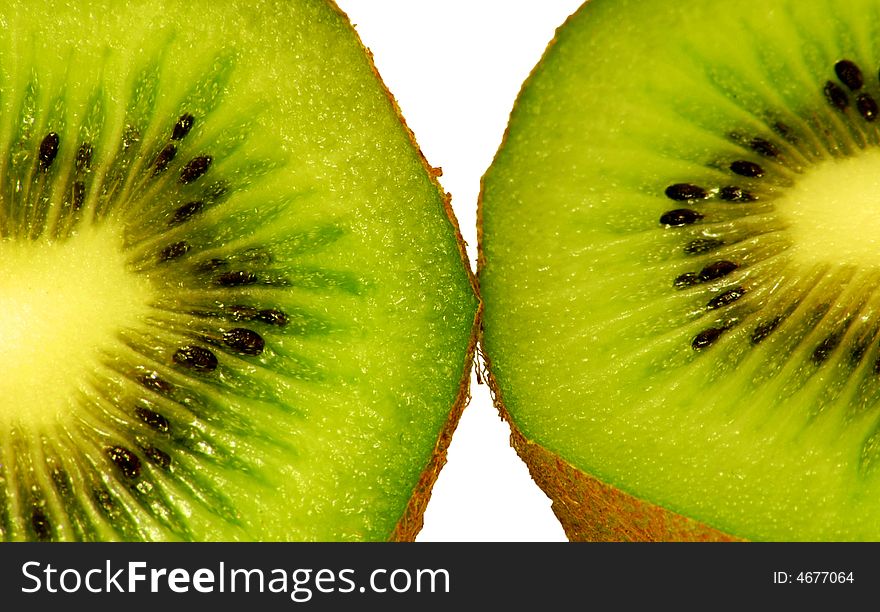 Two green fresh kiwi on the white background. Two green fresh kiwi on the white background
