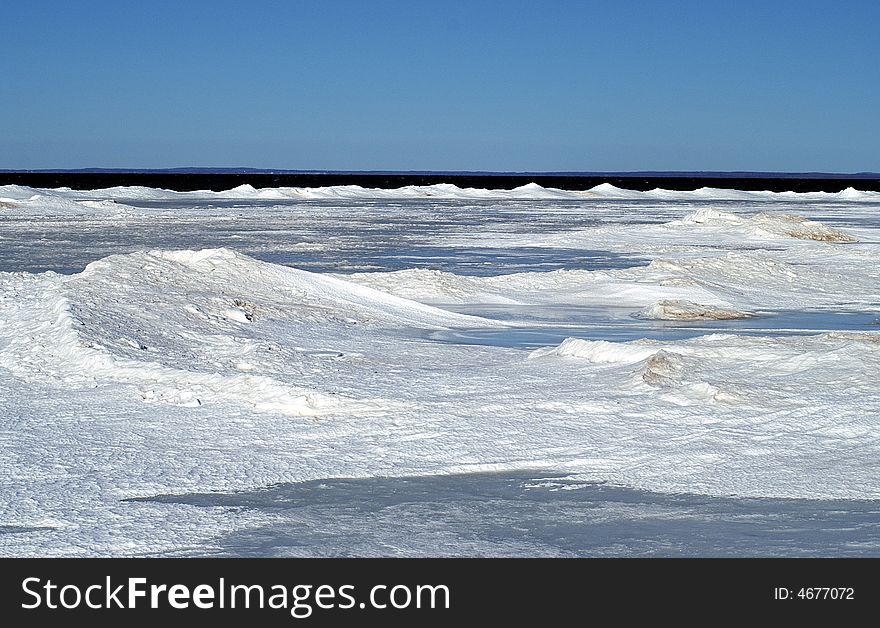 Georgian Bay shoreline covered in ice and snow. Georgian Bay shoreline covered in ice and snow