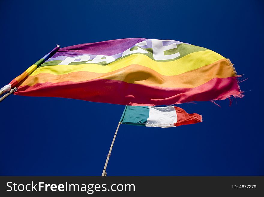 The peace flag on the blue sky