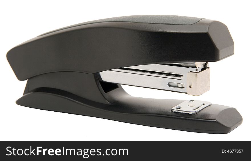 Black stapler on a white background. Photo.