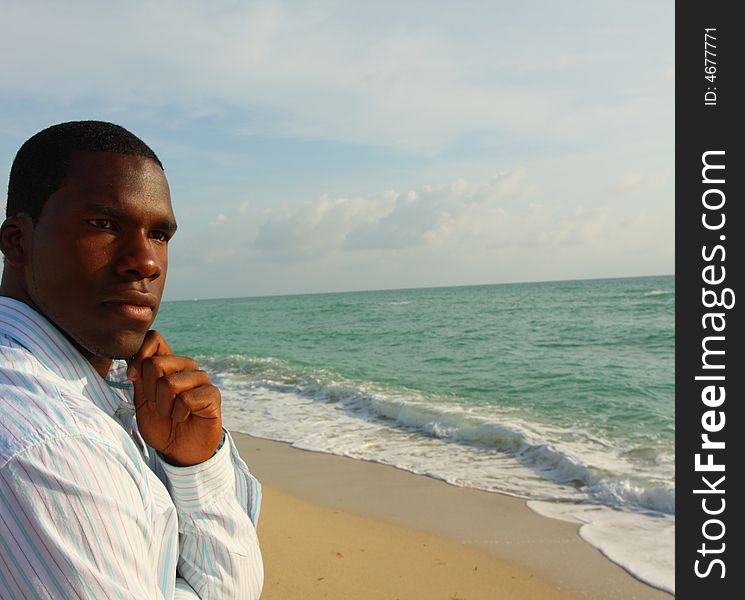 Attractive young black man by the sea shore. Attractive young black man by the sea shore