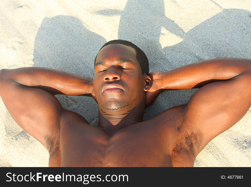 Man laying on the beach sand. Man laying on the beach sand