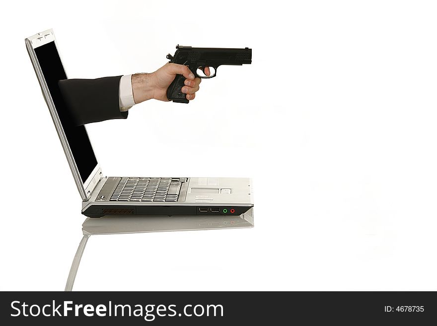 Businessman shooting his laptop computer with a handgun