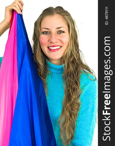 Joyfully smiling young woman with a blue and purple flag