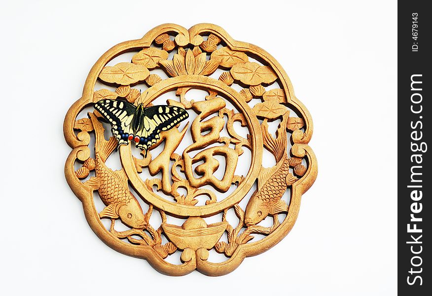 A butterfly stays on benediction ornament ,in the white background