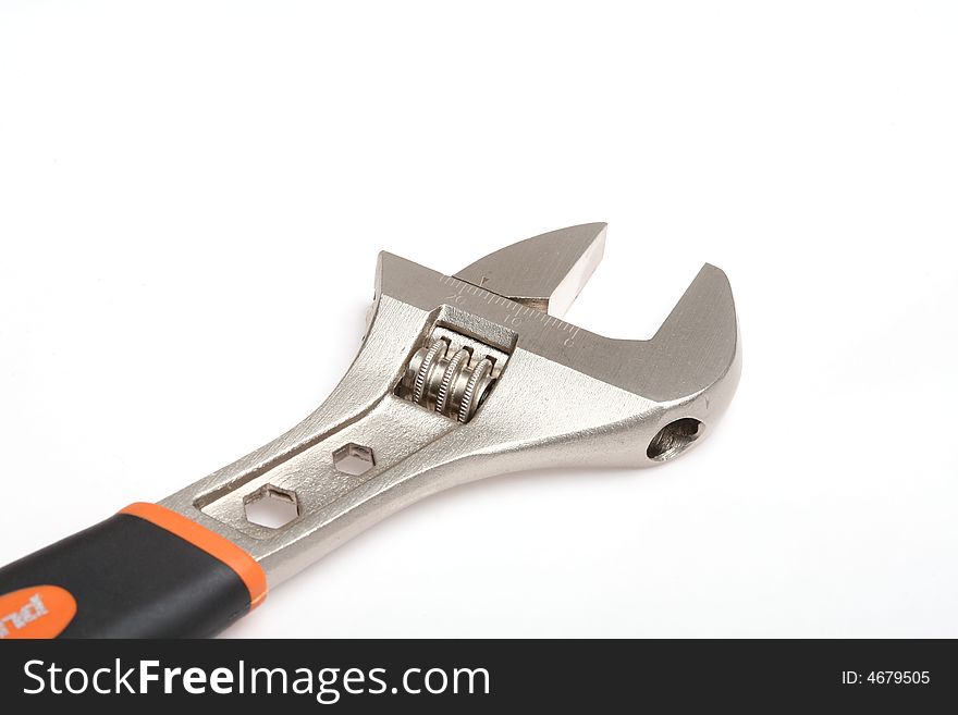 Isolated adjustable wrench on white background