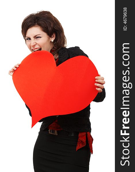 A woman biting a big red heart. A woman biting a big red heart