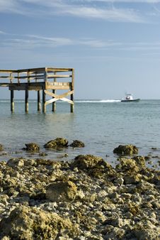 Pier Rocky Shoreline With Boat Stock Images Pier Rocky Shoreline With Boat Stock Images
