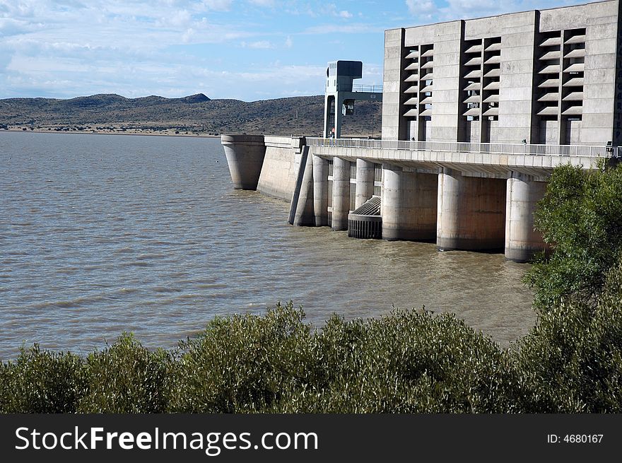 A large concrete dam wall, photographed in South Africa.