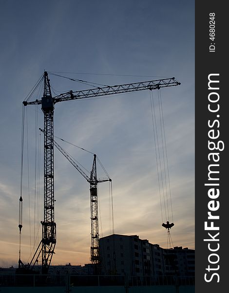 Silhouette of the building crane. Silhouette of the building crane