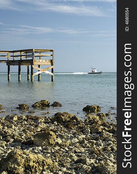 Pier rocky shore coastline with boat sunset park key colony beach florida keys. Pier rocky shore coastline with boat sunset park key colony beach florida keys