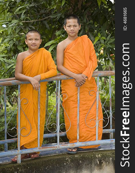 Buddhist monk from Thailand in traditional orange garb