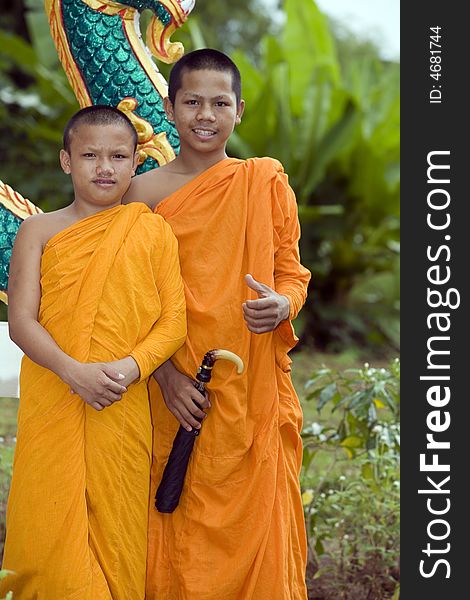 Buddhist monk from Thailand in traditional orange garb