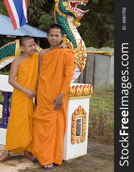 Buddhist monk from Thailand in traditional orange garb