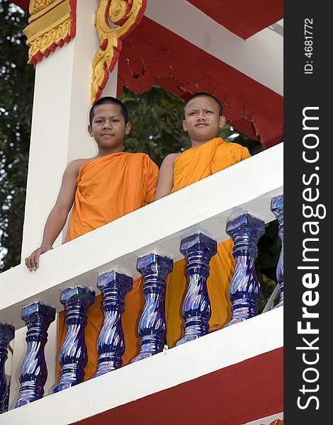 Buddhist monk from Thailand in traditional orange garb