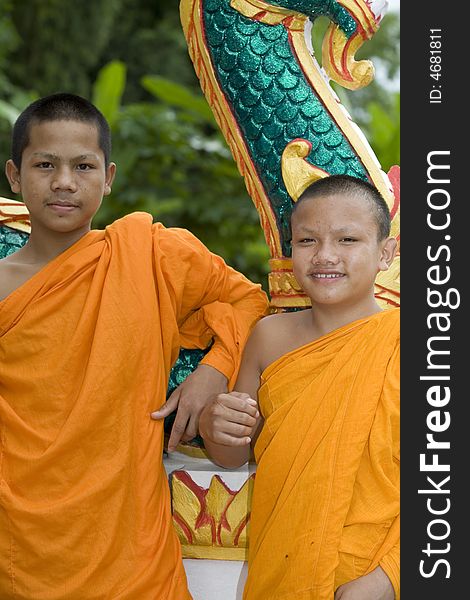 Buddhist monk from Thailand in traditional orange garb