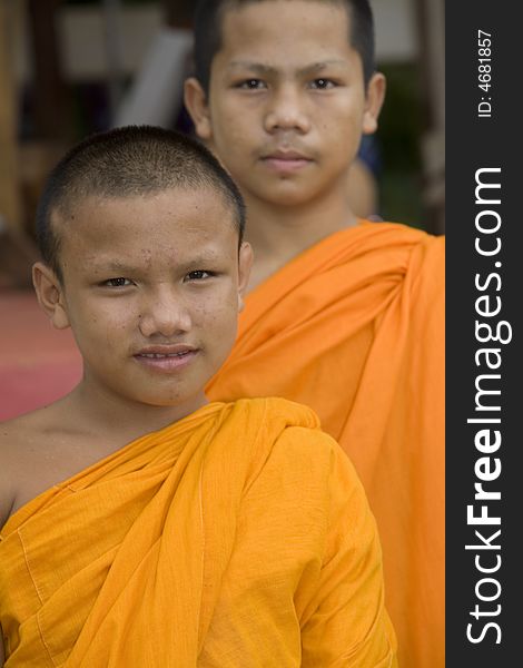 Buddhist monk from Thailand in traditional orange garb