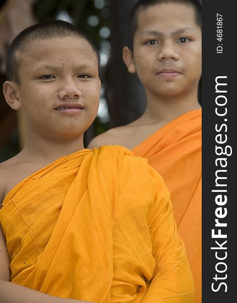 Buddhist monk from Thailand in traditional orange garb