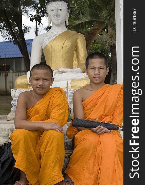 Buddhist monk from Thailand in traditional orange garb