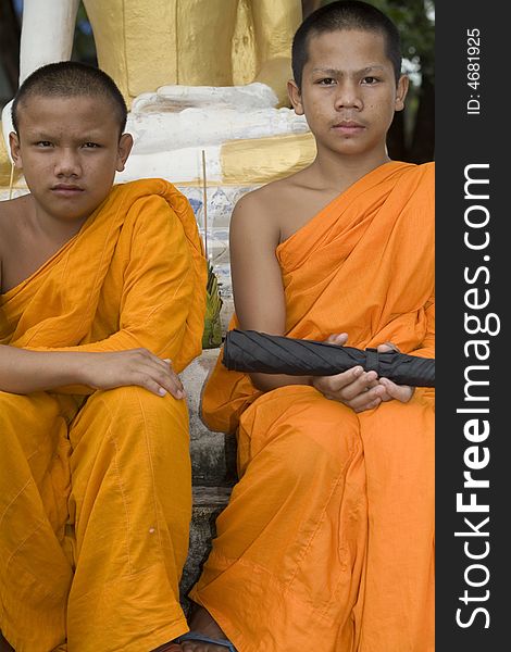 Buddhist monk from Thailand in traditional orange garb