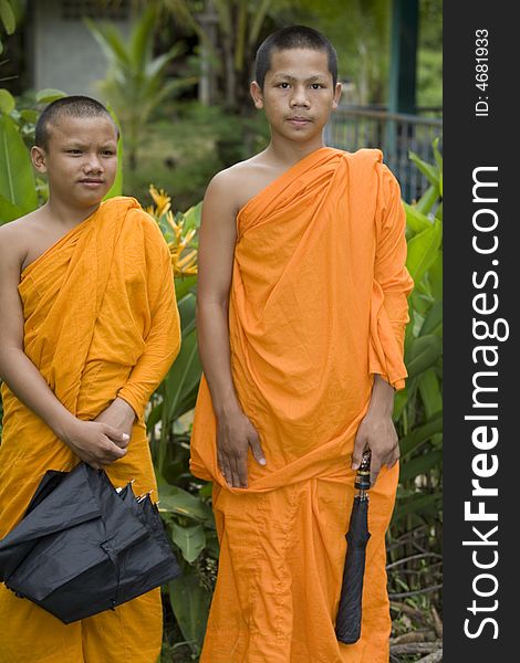 Buddhist monk from Thailand in traditional orange garb