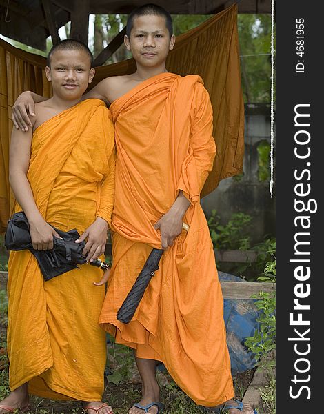 Buddhist monk from Thailand in traditional orange garb