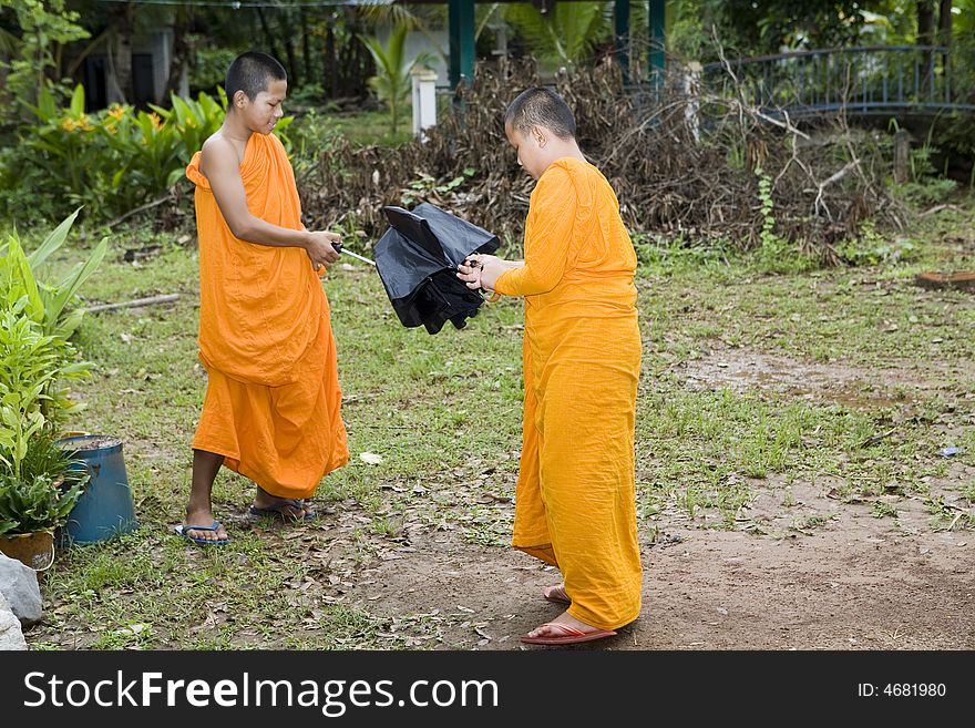 Buddhist monk from Thailand in traditional orange garb