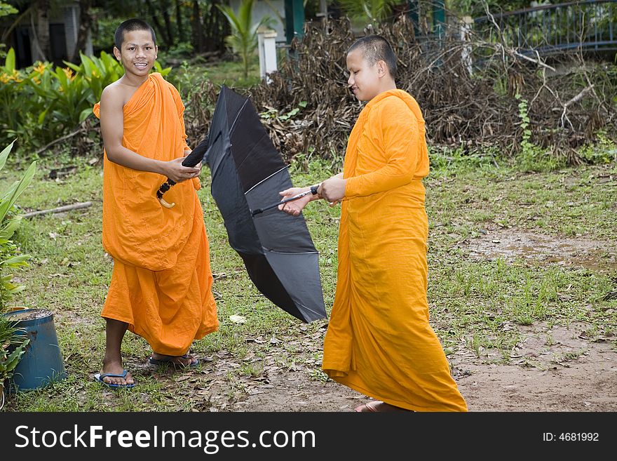 Buddhist monk from Thailand in traditional orange garb