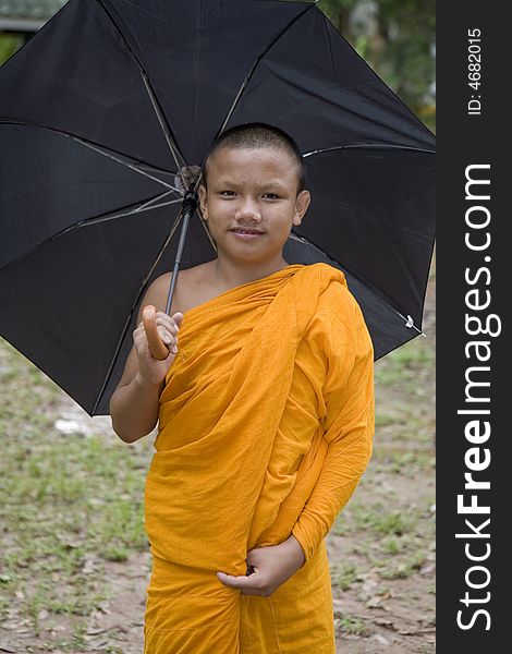 Buddhist monk from Thailand in traditional orange garb