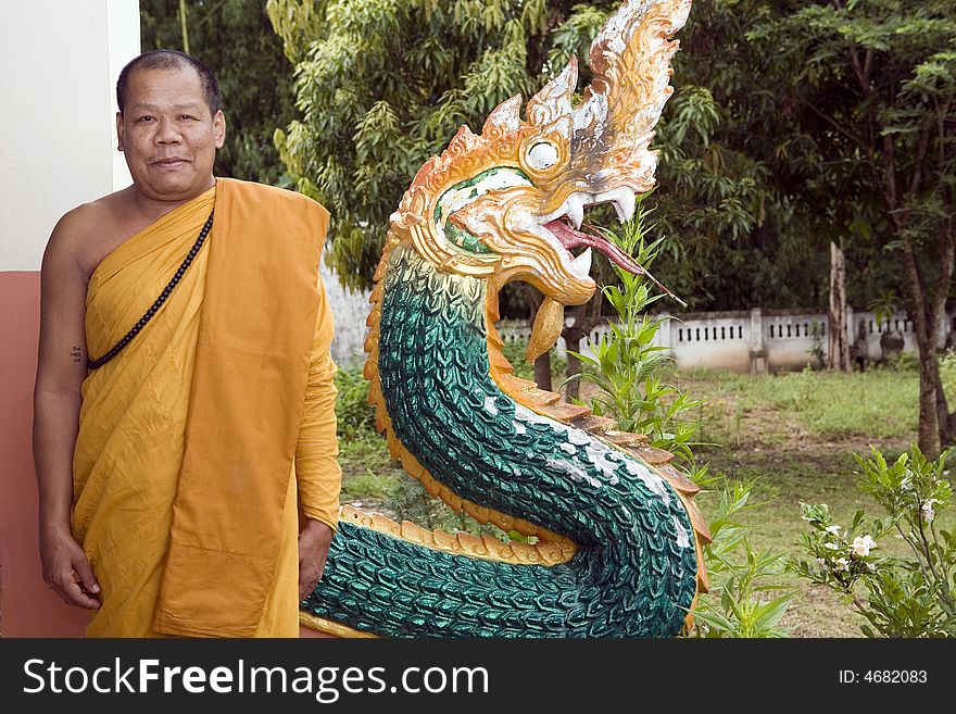 Buddhist monk from Thailand in traditional orange garb