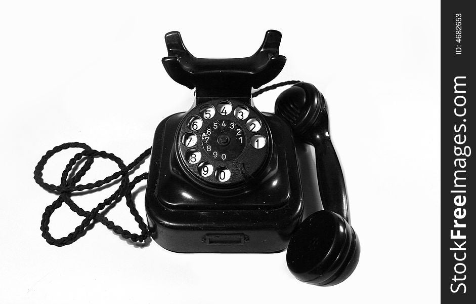 Old classic black telephone on white background. Old classic black telephone on white background