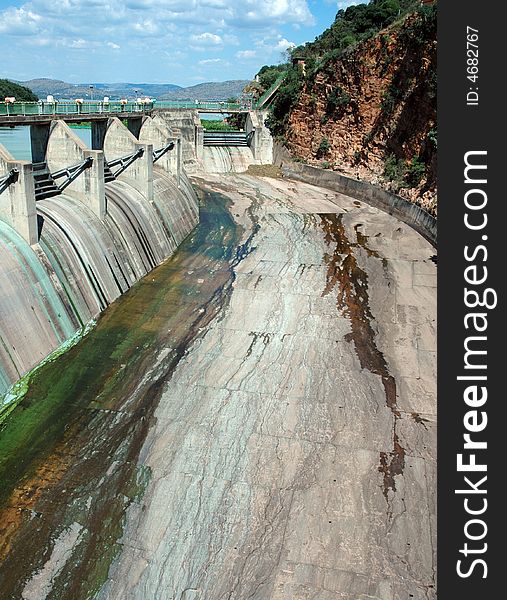 A large concrete dam wall, photographed in South Africa.