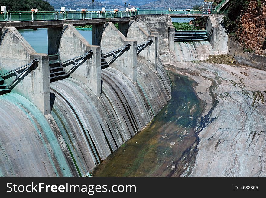 A large concrete dam wall, photographed in South Africa.