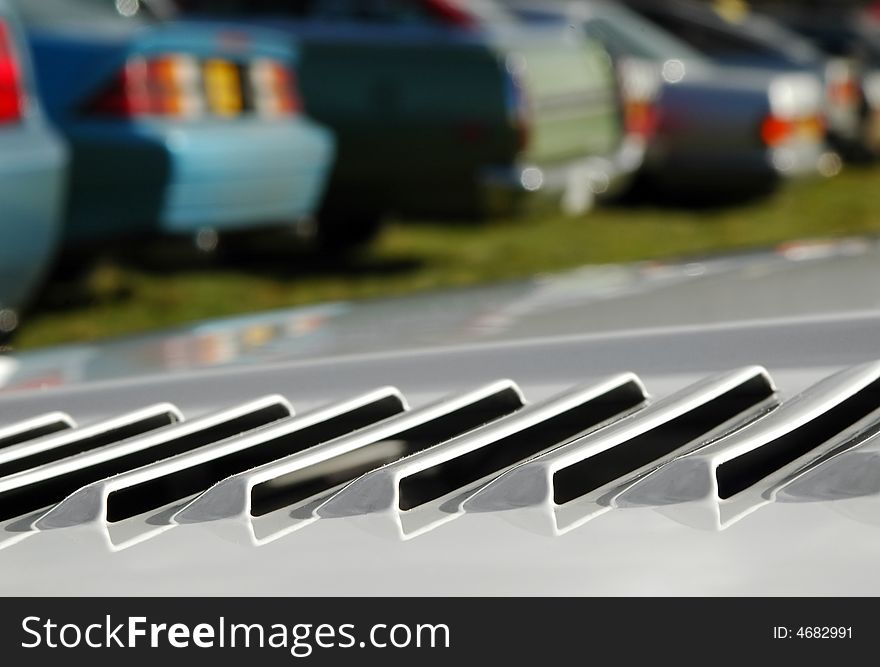 Engine vent on a sports car in a parking lot