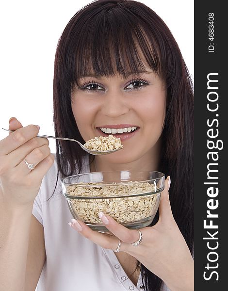Woman eats cereals from saucer