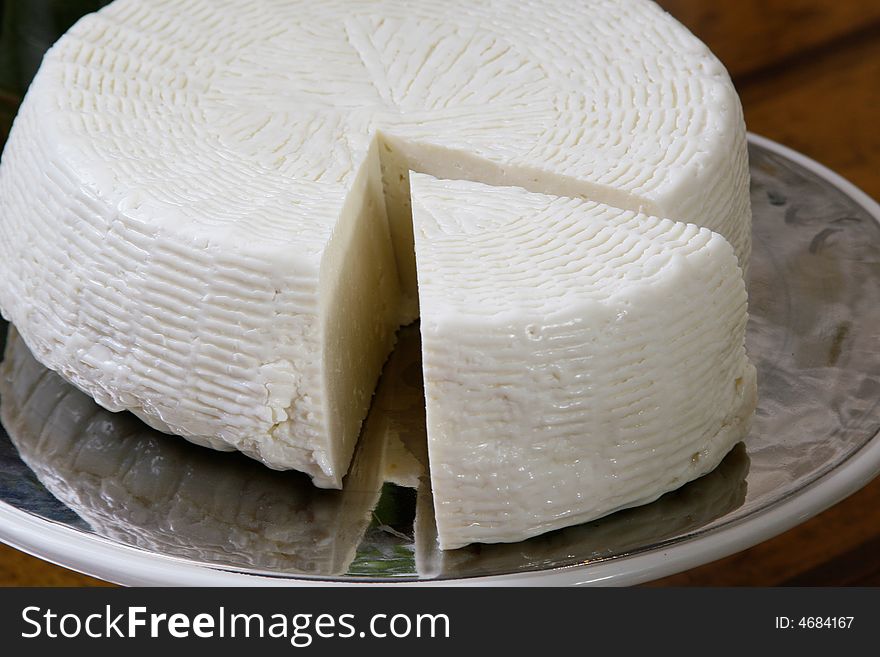 Salty hard cheese, Greek style, on a table