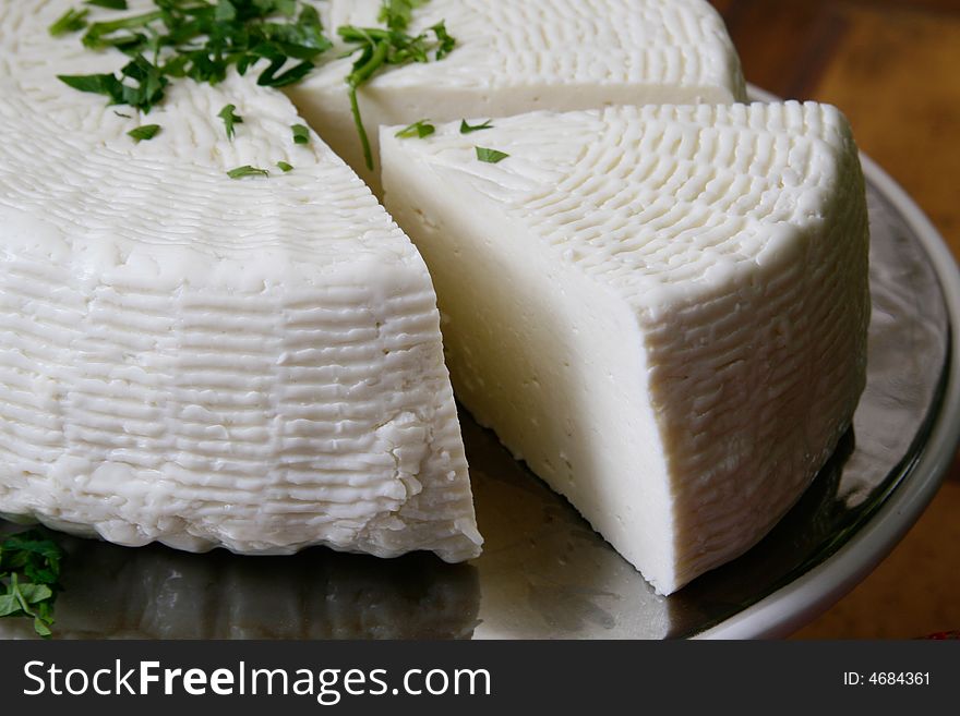 Salty hard cheese, Greek style, on a table
