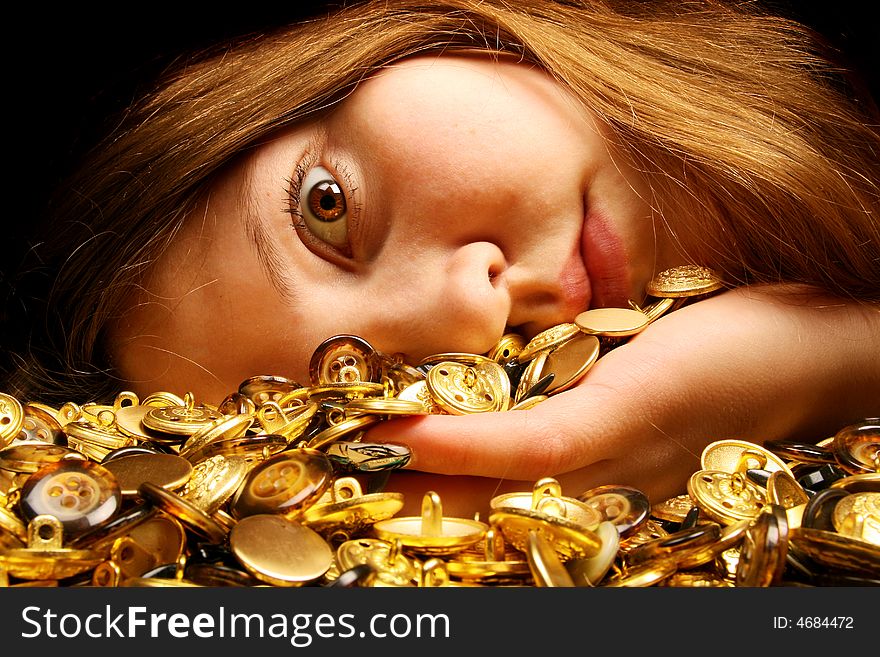A lot of gold buttons and expressive eye of the girl. A lot of gold buttons and expressive eye of the girl