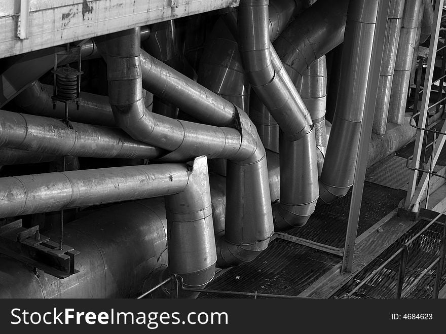 An assortment of different size and shaped pipes at a power plant