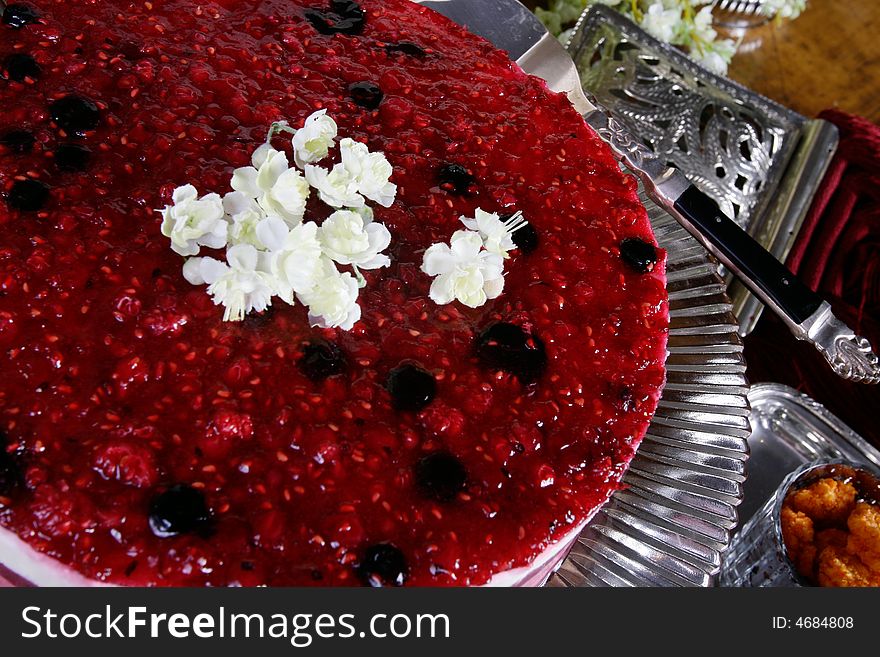 Red raspberry covered cheese cake