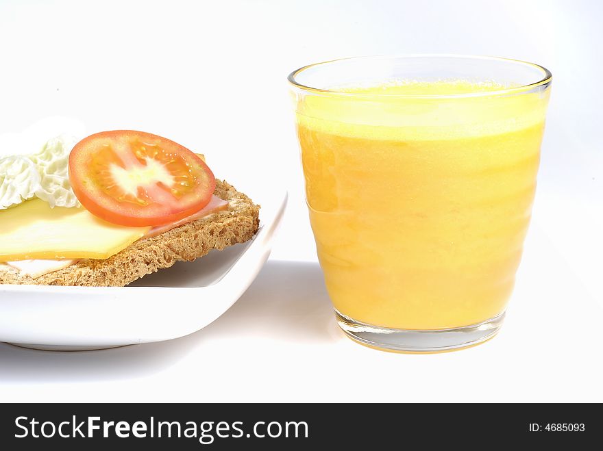 Orange juice and sandwich on the white background. Orange juice and sandwich on the white background