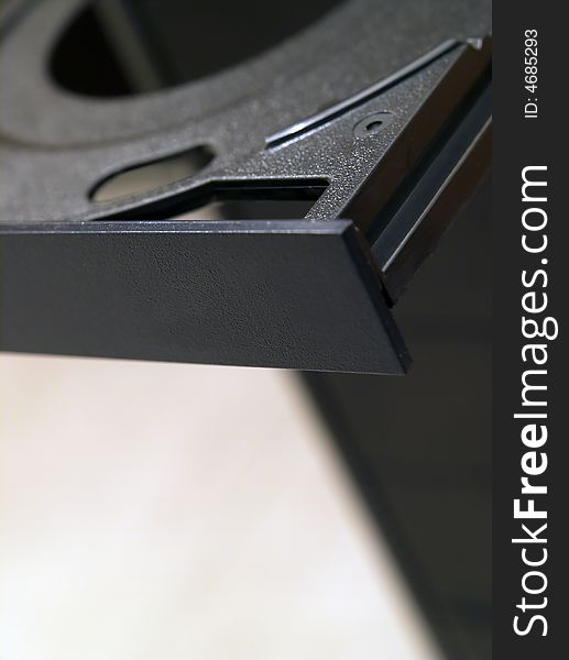 A detail of a computer black dvd reader. A detail of a computer black dvd reader